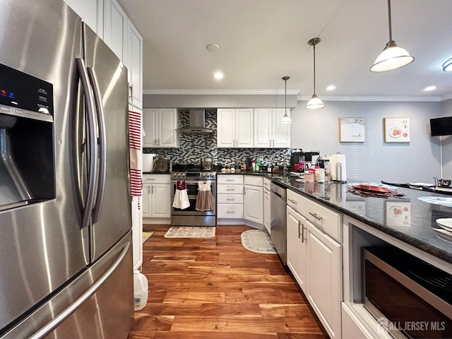 196 Jonathan Pl, Franklin Twsp, NJ 08873 - kitchen with appliances with stainless steel finishes, wall chimney exhaust hood, ornamental molding, white cabinets, and backsplash