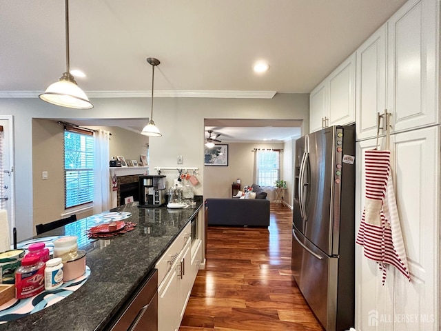 196 Jonathan Pl, Franklin Twsp, NJ 08873 - kitchen with stainless steel fridge, wood finished floors, white cabinetry, decorative light fixtures, and ornamental molding