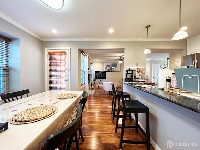 196 Jonathan Pl, Franklin Twsp, NJ 08873 - dining space featuring dark wood-type flooring, plenty of natural light, crown molding, recessed lighting, and a ceiling fan