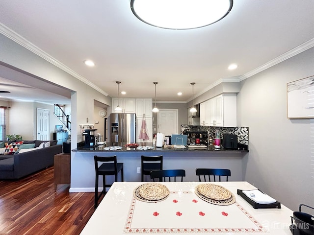 196 Jonathan Pl, Franklin Twsp, NJ 08873 - dining room with dark wood-style floors, crown molding, recessed lighting, and stairway