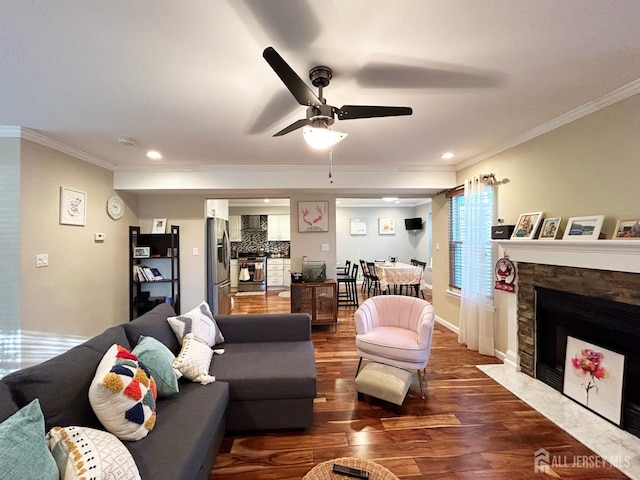 196 Jonathan Pl, Franklin Twsp, NJ 08873 - living room with ornamental molding, ceiling fan, wood finished floors, a stone fireplace, and recessed lighting
