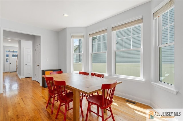 dining area with light wood-style floors, baseboards, and recessed lighting