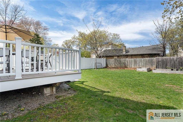 view of yard with a deck