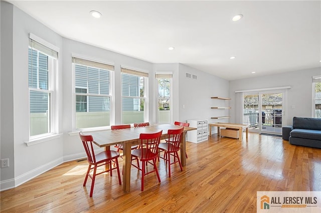 dining area featuring light wood finished floors, recessed lighting, and baseboards