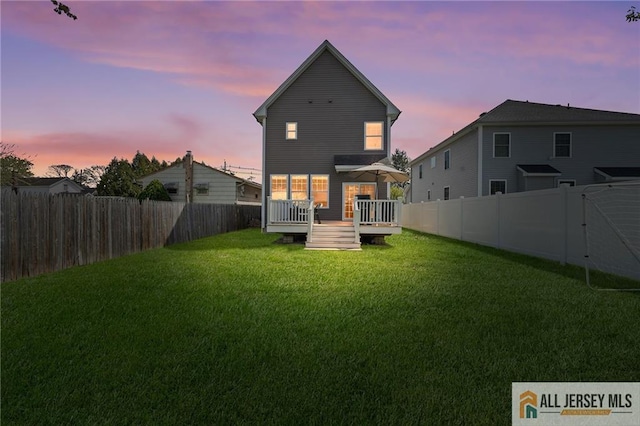 rear view of property with a wooden deck