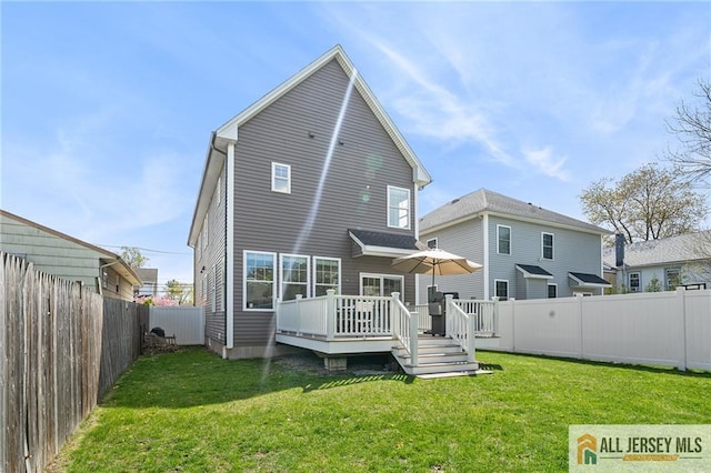rear view of house with a deck