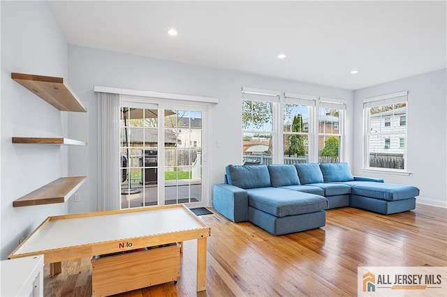 living room featuring wood finished floors and recessed lighting