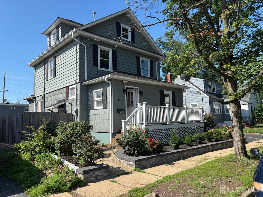 647 Front St, Dunellen, NJ 08812 - traditional style home featuring a wooden deck