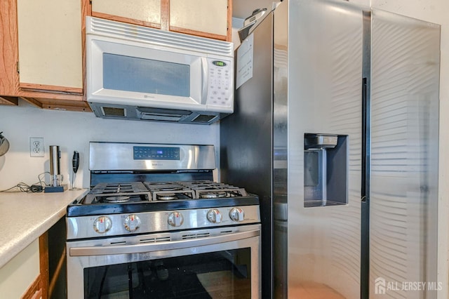62 La Rue Ln, East Brunswick, NJ 08816 - kitchen featuring appliances with stainless steel finishes and light countertops
