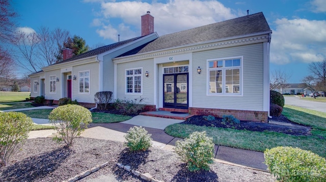 52-C Rutland Ln, Monroe, NJ 08831 - view of front facade with a chimney and a front lawn