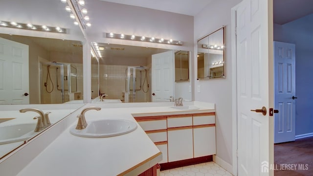 52-C Rutland Ln, Monroe, NJ 08831 - bathroom featuring a stall shower, double vanity, and tile patterned flooring