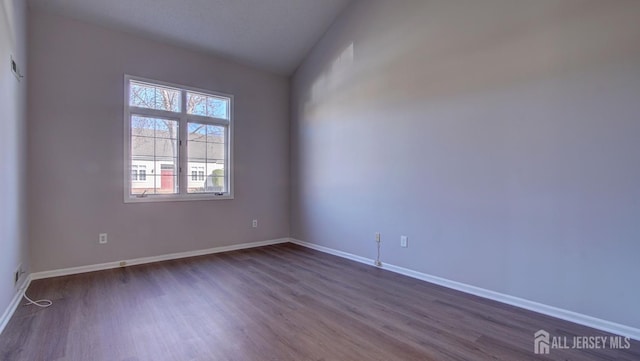 52-C Rutland Ln, Monroe, NJ 08831 - spare room featuring dark wood-type flooring and baseboards