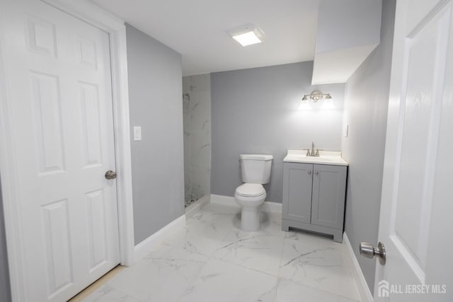 full bathroom with marble finish floor, toilet, vanity, and a marble finish shower