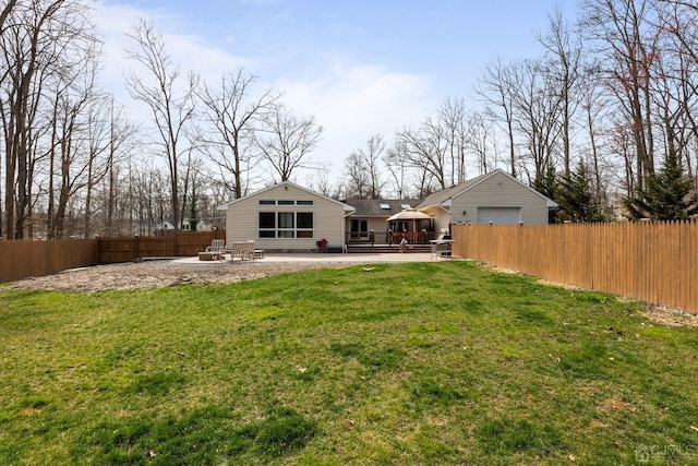 back of property featuring a yard, a deck, and a patio area