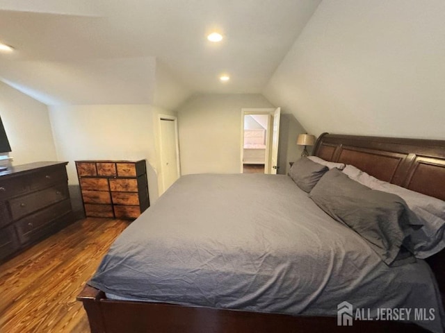 45 E Oak St, Carteret, NJ 07008 - bedroom featuring wood finished floors, vaulted ceiling, a closet, and recessed lighting