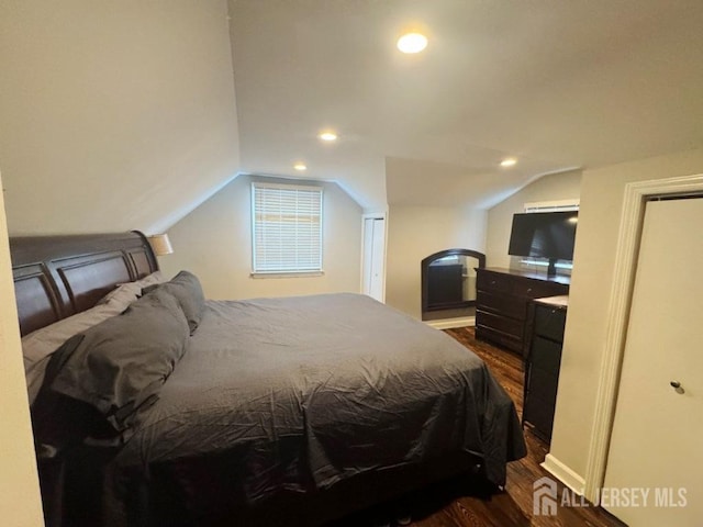 45 E Oak St, Carteret, NJ 07008 - bedroom with dark wood-style floors, vaulted ceiling, and recessed lighting
