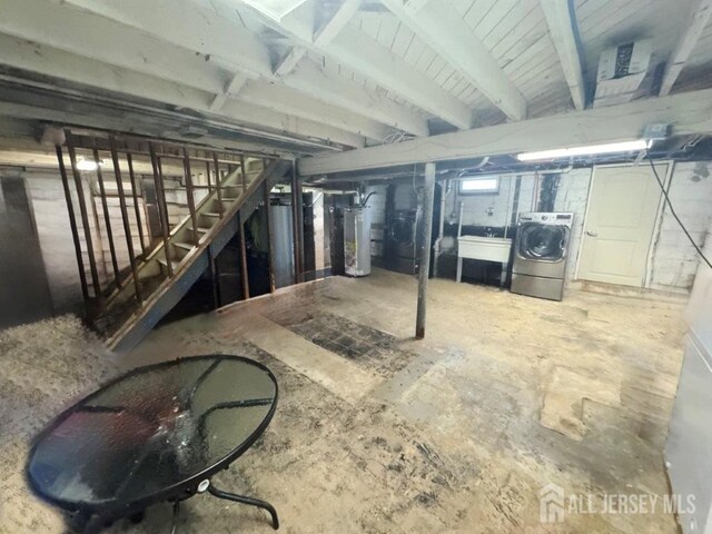 45 E Oak St, Carteret, NJ 07008 - basement with washer / clothes dryer, water heater, and stairs