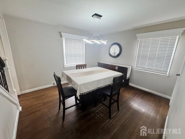 45 E Oak St, Carteret, NJ 07008 - dining area featuring wood finished floors and a chandelier