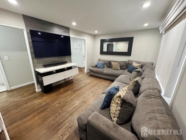 45 E Oak St, Carteret, NJ 07008 - living area with wood finished floors and recessed lighting