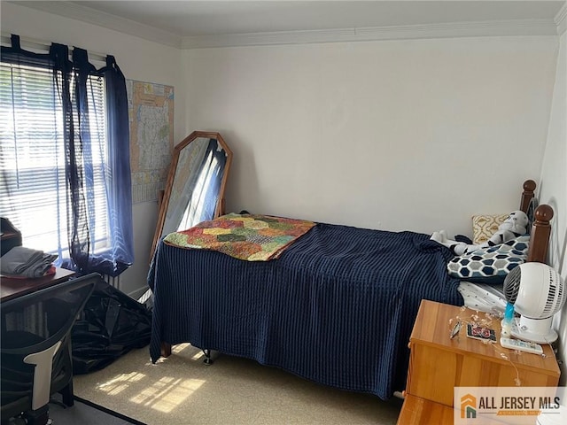 bedroom with carpet and ornamental molding