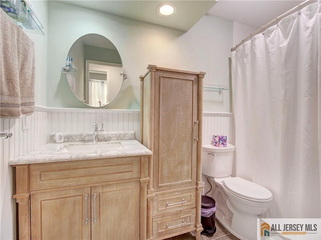 285 Cozzens Ct Unit 285, East Brunswick, NJ 08816 - bathroom featuring a wainscoted wall, vanity, and a shower with shower curtain