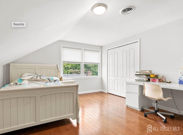 13 Crabtree Rd, Old Bridge, NJ 07747 - bedroom featuring wood finished floors, an office area, vaulted ceiling, baseboards, and a closet