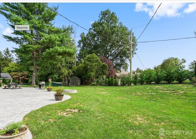 13 Crabtree Rd, Old Bridge, NJ 07747 - view of green lawn featuring a patio area