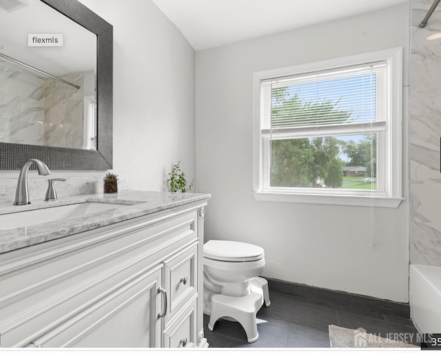 13 Crabtree Rd, Old Bridge, NJ 07747 - bathroom featuring vanity, toilet, and baseboards