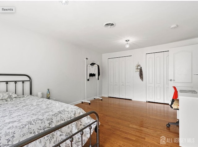 13 Crabtree Rd, Old Bridge, NJ 07747 - bedroom with multiple closets, wood finished floors, and baseboards