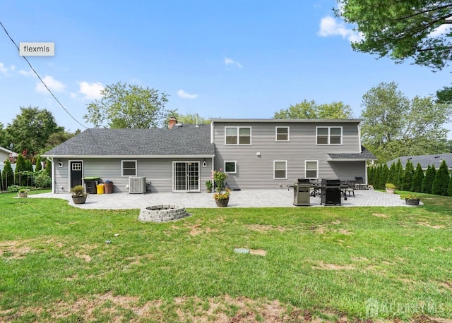 13 Crabtree Rd, Old Bridge, NJ 07747 - back of property with a fire pit, a patio, a yard, and central AC