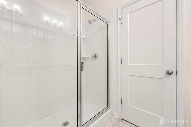 70 Depot Way, Dunellen, NJ 08812 - bathroom featuring a stall shower and marble look tiles
