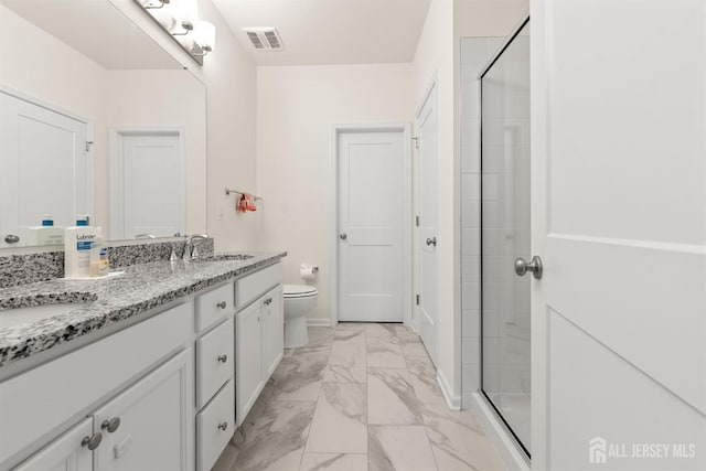 full bath with visible vents, vanity, marble finish floor, toilet, and a stall shower