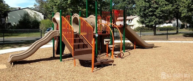 community jungle gym featuring fence