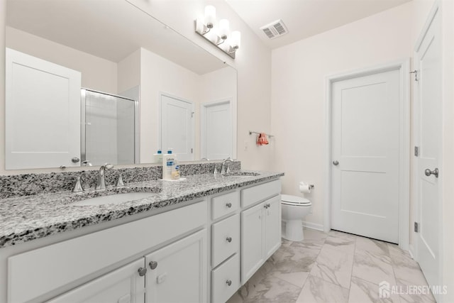 full bathroom featuring a sink, marble finish floor, a stall shower, and toilet