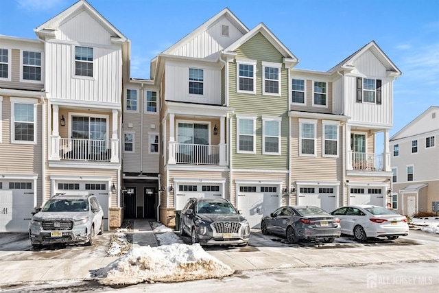 70 Depot Way, Dunellen, NJ 08812 - townhome / multi-family property featuring an attached garage, driveway, and board and batten siding
