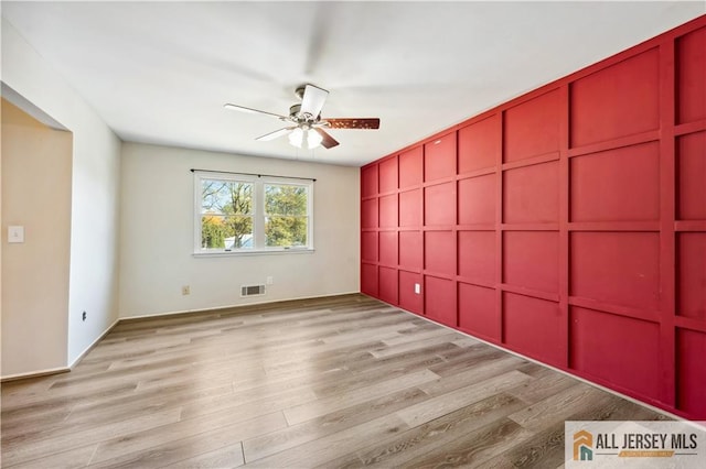 unfurnished bedroom featuring ceiling fan and light wood-type flooring