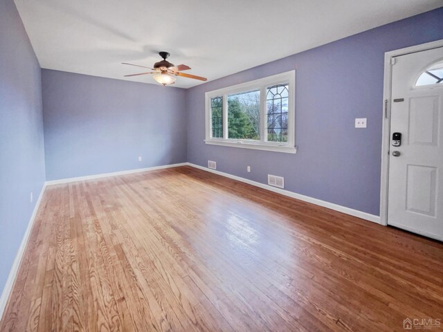 foyer featuring ceiling fan and hardwood / wood-style flooring