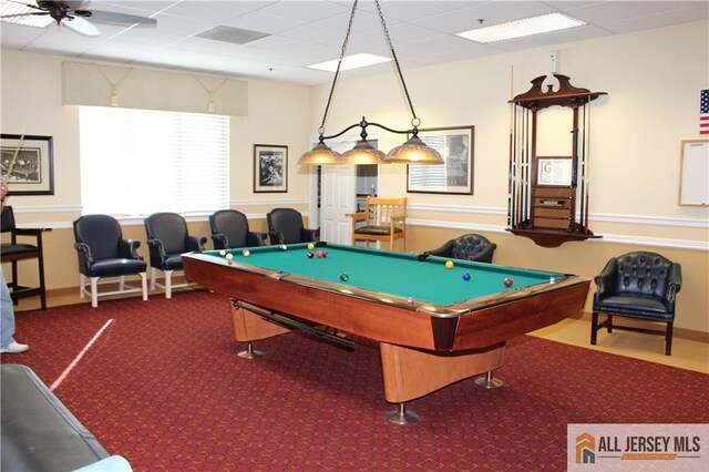 rec room with carpet floors, a drop ceiling, a ceiling fan, and pool table