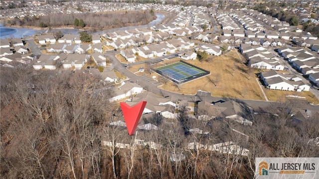 birds eye view of property with a residential view