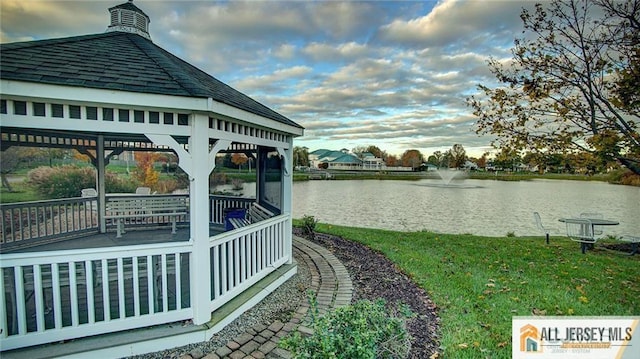 view of dock featuring a water view and a gazebo