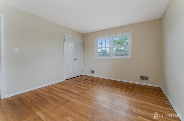 104 Laurel Ave, South Plainfield, NJ 07080 - spare room with light wood-type flooring and baseboards