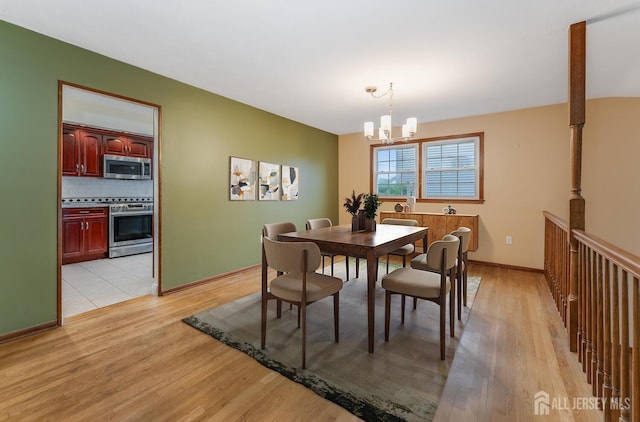 104 Laurel Ave, South Plainfield, NJ 07080 - dining space featuring a chandelier and light wood-style floors