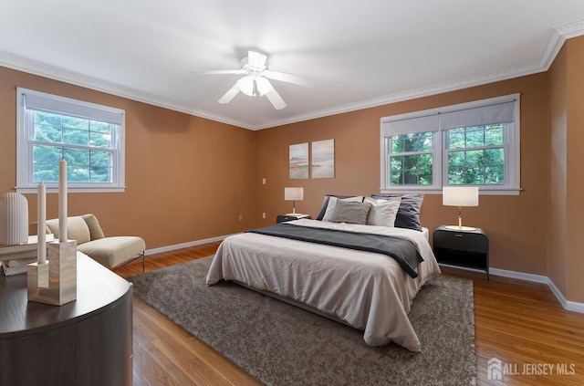 104 Laurel Ave, South Plainfield, NJ 07080 - bedroom with ornamental molding, wood finished floors, and ceiling fan