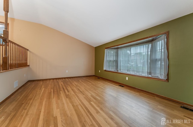 104 Laurel Ave, South Plainfield, NJ 07080 - unfurnished living room with light wood-style floors and vaulted ceiling