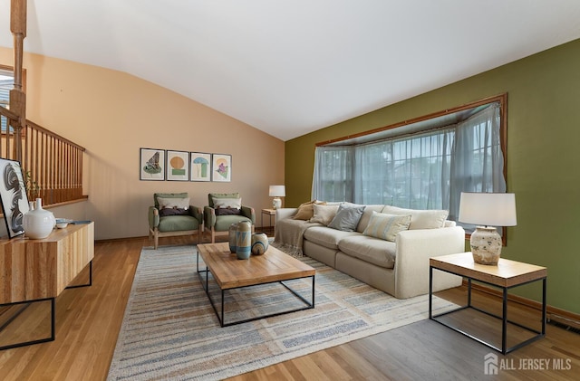 104 Laurel Ave, South Plainfield, NJ 07080 - living room with vaulted ceiling and light wood-style flooring