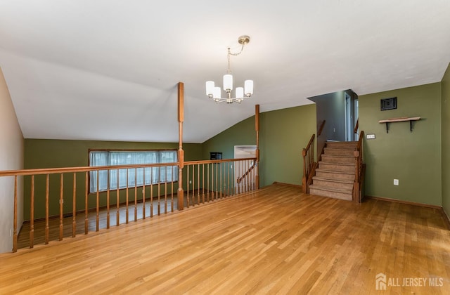 104 Laurel Ave, South Plainfield, NJ 07080 - unfurnished room featuring a chandelier, wood finished floors, and lofted ceiling