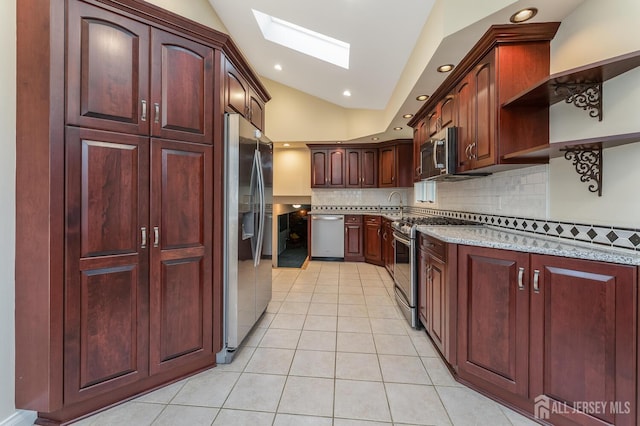 104 Laurel Ave, South Plainfield, NJ 07080 - kitchen with appliances with stainless steel finishes, a skylight, light tile patterned floors, lofted ceiling, and decorative backsplash