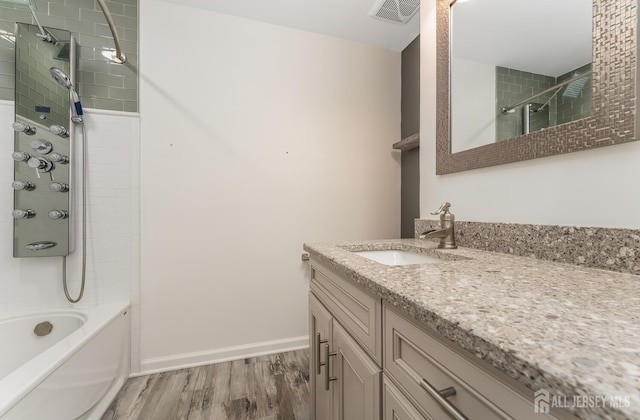 104 Laurel Ave, South Plainfield, NJ 07080 - full bath with wood finished floors, vanity, and  shower combination