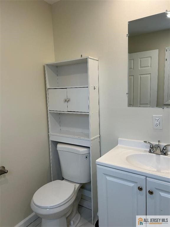 23 June St, South River, NJ 08882 - bathroom featuring toilet, vanity, and baseboards