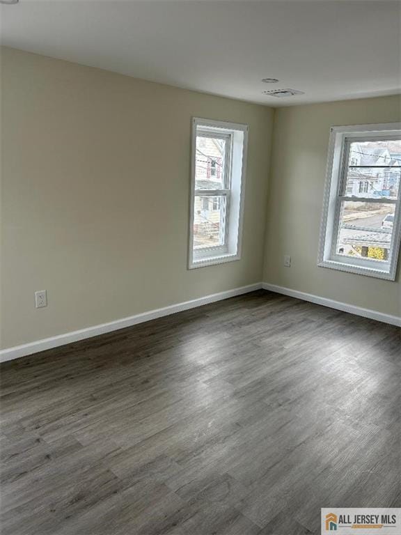 23 June St, South River, NJ 08882 - spare room featuring dark wood finished floors and baseboards